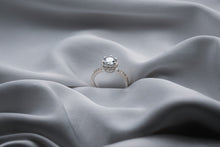 Load image into Gallery viewer, Silver diamond ring on a gray fabric surface