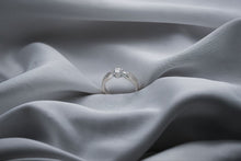 Load image into Gallery viewer, Diamond ring on a textured gray fabric surface