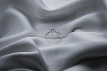 Load image into Gallery viewer, Silver diamond ring on a textured gray fabric surface