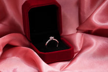 Load image into Gallery viewer, Silver diamond ring in a red velvet box on pink satin fabric