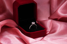 Load image into Gallery viewer, Diamond ring in a red box on pink fabric