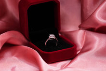 Load image into Gallery viewer, Diamond ring in a red velvet box on pink fabric