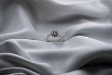 Load image into Gallery viewer, Silver ring with a diamond on a textured gray fabric background