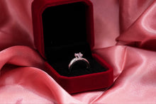 Load image into Gallery viewer, Silver diamond ring in a red box on pink fabric