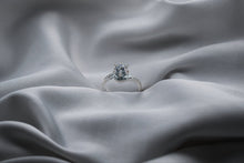 Load image into Gallery viewer, Silver diamond ring on a silver satin fabric
