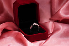 Load image into Gallery viewer, Diamond ring in a red velvet box on pink fabric