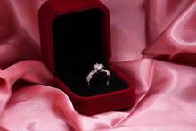 Load image into Gallery viewer, Silver diamond ring in a red velvet box on pink fabric