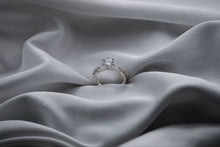 Load image into Gallery viewer, Silver ring with a diamond on gray fabric
