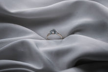 Load image into Gallery viewer, Diamond ring on a gray fabric surface
