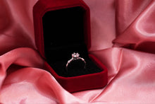 Load image into Gallery viewer, Silver diamond ring in a red box on pink fabric
