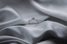 Load image into Gallery viewer, Silver ring on a gray fabric surface
