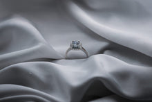 Load image into Gallery viewer, Diamond ring on a textured gray fabric surface
