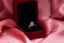 Load image into Gallery viewer, Silver diamond ring in a red velvet box on pink fabric
